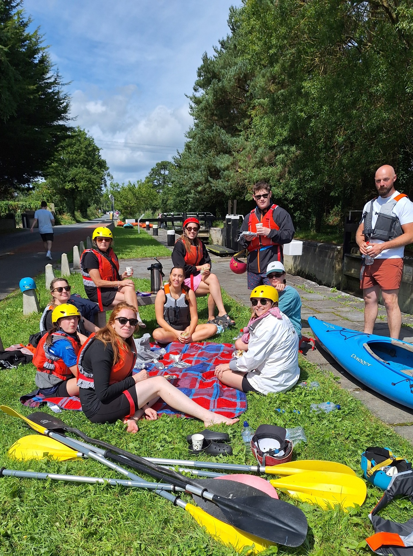 A group of kayakers on the River Boyne beneath a bridge